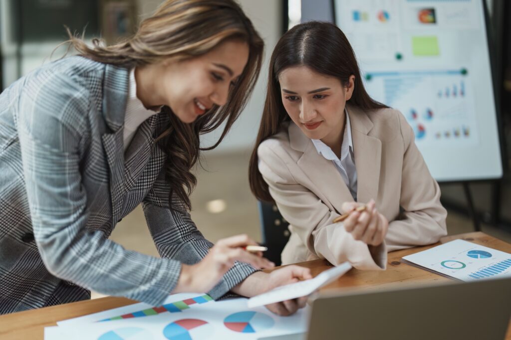 Financial analysts analyzing business reports on planned investment projects